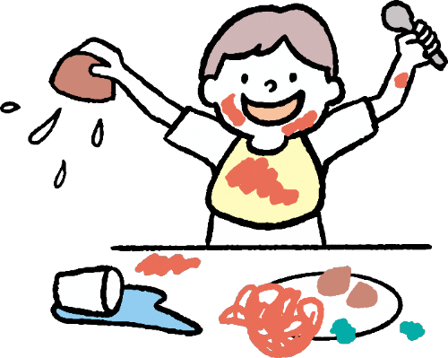 散らかしながら自分で食べる子ども